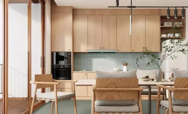 A kitchen with wooden fronts. A dining table with chairs in the front